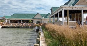 A green roofed building by the docks of Ocean City