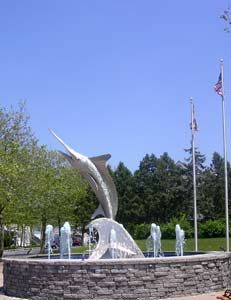 A stone fountain with a white marlin